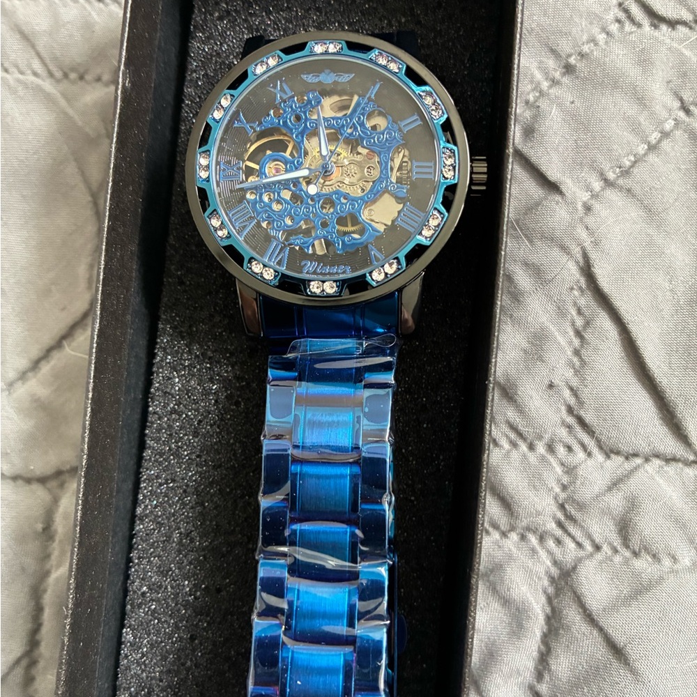 Blue Skeleton Dial Watch with Silver Accents